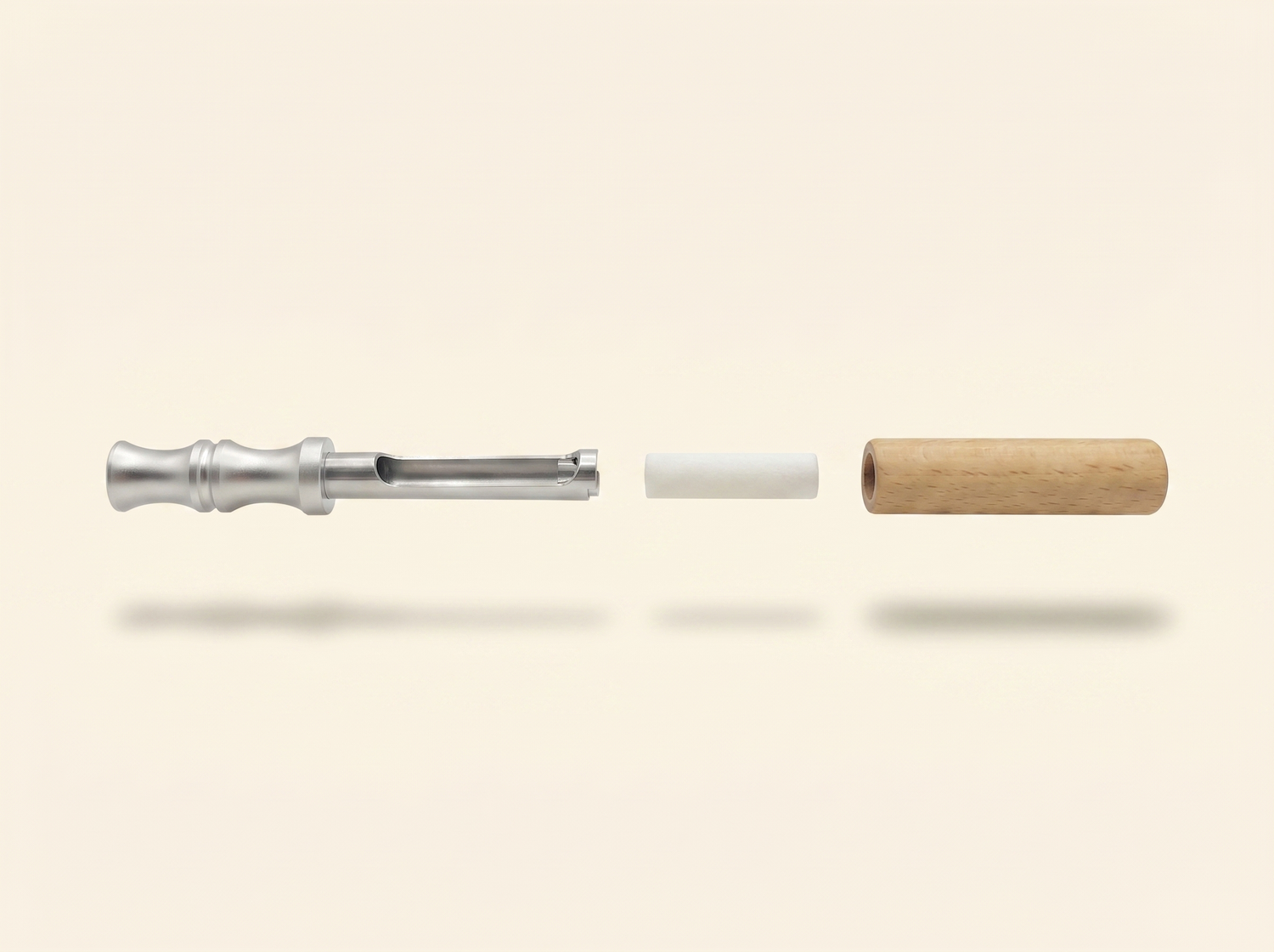 Exploded view of the Crave stick: silver mouthpiece and air tube, white flavour core, and light wooden body